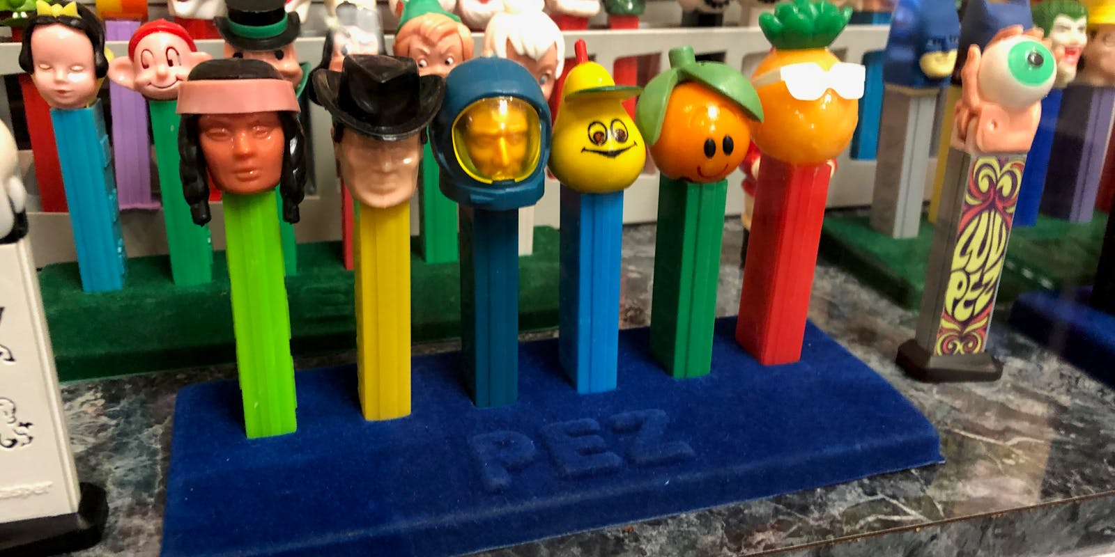 Six antique Pez dispensers on display