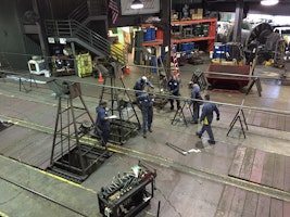 Technicians replacing a cable.