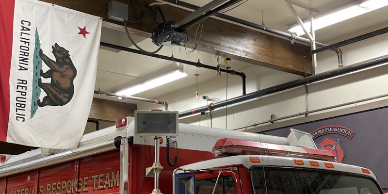 The bulb hanging from the fire station ceiling.