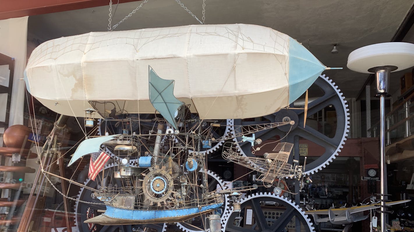 A steampunk airship in the window.