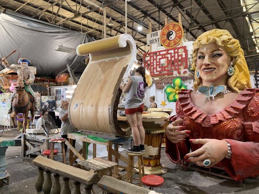 An artist working on a piece for a float