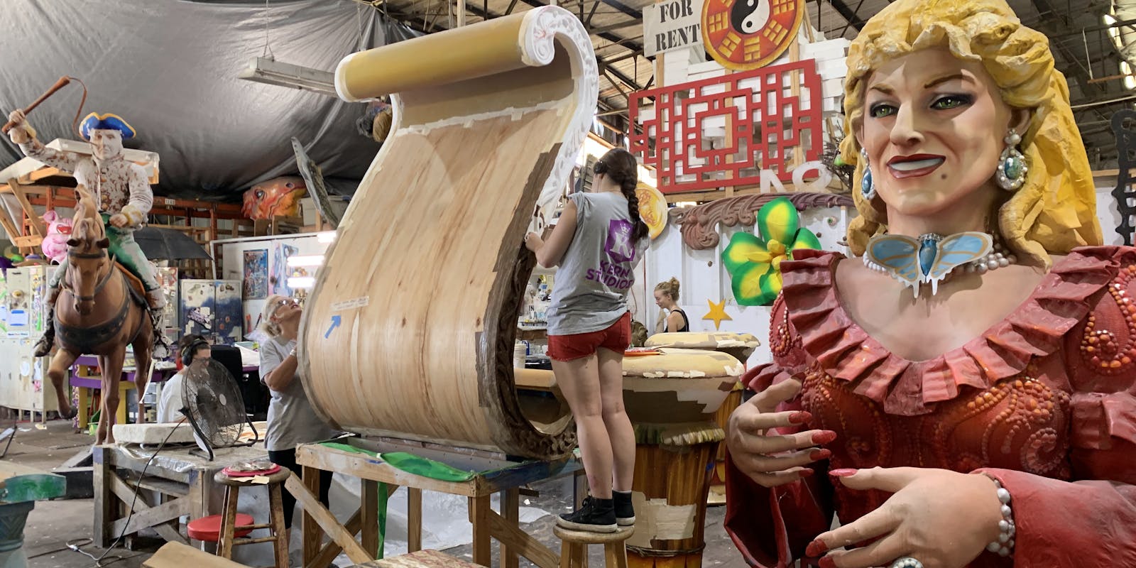 An artist working on a piece for a float