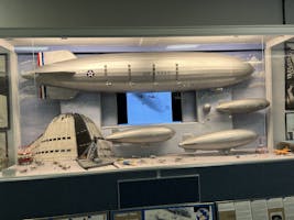 A diorama showing the scale of the USS Macon airship