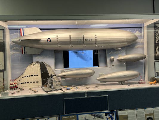 A diorama showing the scale of the USS Macon airship